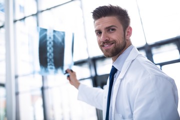 Doctor holding X-ray report