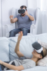 People playing games with VR goggles