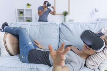 Woman laying with VR glasses