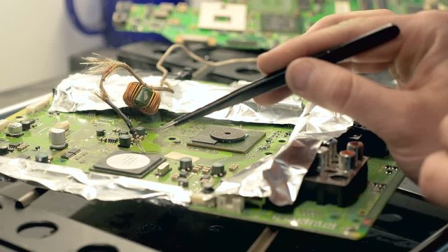Soldering and reparing electronic circuit board