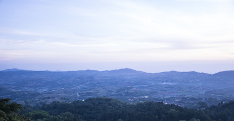 Fototapeta na wymiar beautiful green mountains/Hills with blue sky background. Winter landscape season in asia Thailand.