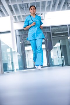 Nurse running in hospital corridor