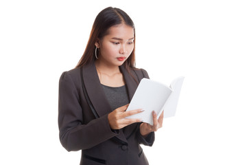 Asian business woman with a book and magnifying glass.