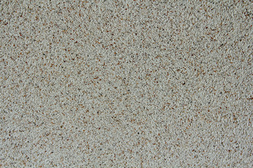 White stone chippings wall. Texture and background