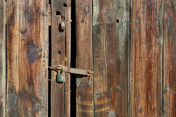 Old wooden door with padlock