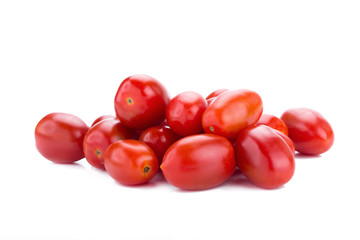 Ripe red tomatoes isolated on white background.