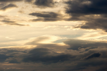 Color of dramatic sky with stormy sunset clouds.