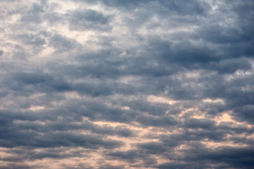 Color of dramatic sky with stormy sunset clouds.