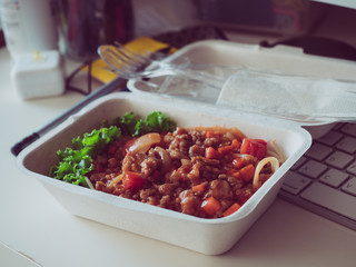 The spaghetti sauce, pork is placed on a desk.