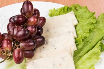 sliced cheese salad and grapes walnut