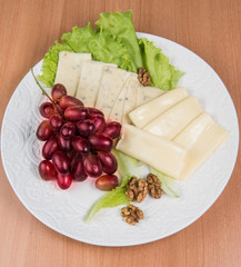 sliced cheese salad and grapes walnut