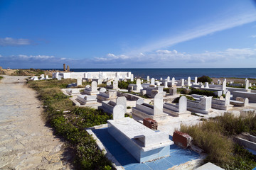 Obraz premium View from the coastal town of Mahdia in Mahdia Governorate of Tunisia, eastern Mediterranean coast with ruins of Fatimid Caliphate and graveyard.