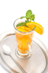 hot citrus or orange hot drink with orange slices and mint leaf, product photography for restaurant 