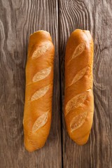 Baguettes on wooden background