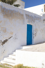 Naklejka premium Traditional ornamental Tunisian door, detail from typical Mediterranean Arabic architecture