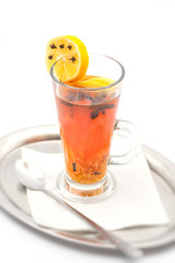 hot citrus drink with alcohol and orange slices and spices, winter drink, product photography for restaurant or cafe