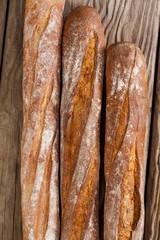 Baguettes on wooden background