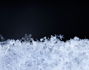 natural snowflakes on snow, photo real snowflakes during a snowfall, under natural conditions at low temperature