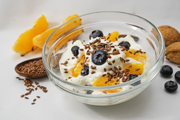 Quark, yogurt or cottage cheese, flax seeds and fresh fruits, healthy breakfast