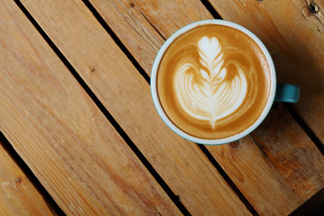 flat-Lay view of hot cappuccino coffee on rough table and have some space for write wording