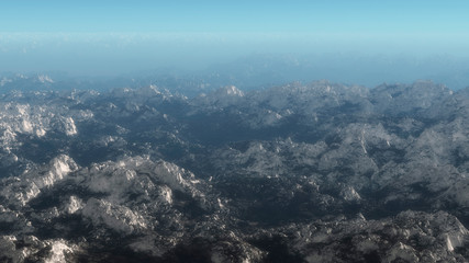 Aerial of mountain range covered with snow.