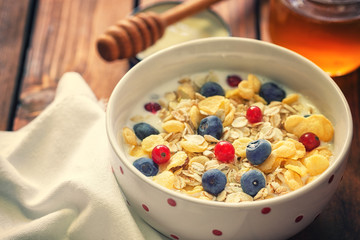 Healthy Breakfast Muesli with berries,honey and milk 
