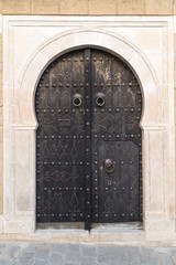 Traditional ornamental Tunisian door, detail from typical Mediterranean Arabic architecture