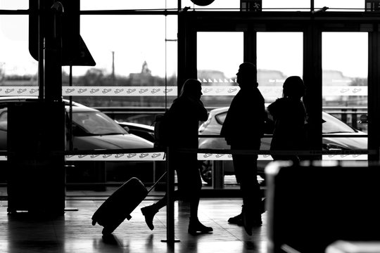 people at the airport black and white