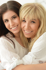 mother and daughter smiling