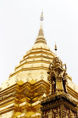 Fototapeta premium Golden pagoda in the temple on background sky.