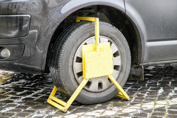 Wrong parked vehicle with yellow wheel clamp