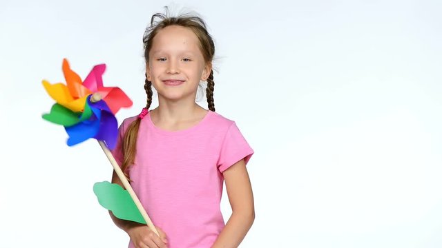 Child with colorful pinwheel toy