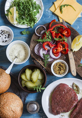 Ingredients for cooking steak burger. On wooden background, top view. Flat lay