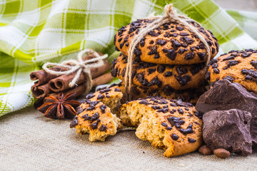 freshly baked chocolate chip cookies on rustic wooden table