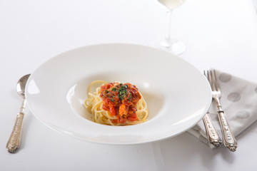 spaghetti tomato tuna on the table 