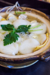 Traditional Shimabara Guzoni - soup with rice cake and seafood
