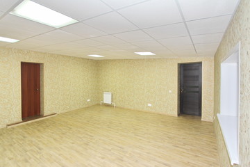 Interior empty office light room with green wallpaper unfurnished in a new building