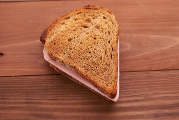 triangular sandwiches on wooden table
