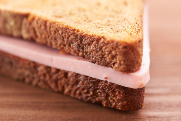 triangular sandwiches on wooden table