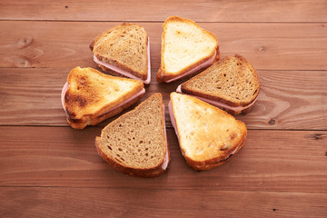 triangular sandwiches on wooden table