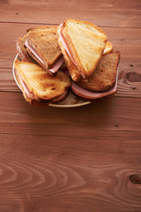 triangular sandwiches on wooden table