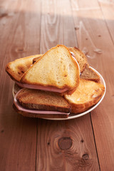 triangular sandwiches on wooden table
