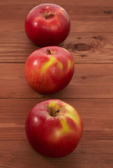 red apples on a wooden table
