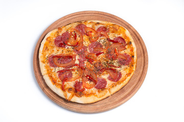 Big appetizing pizza on a wooden tablet