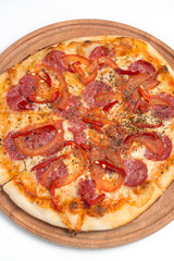 Big appetizing pizza on a wooden tablet