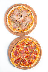 Big appetizing pizza on a wooden tablet
