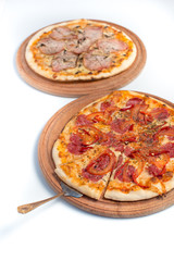 Big appetizing pizza on a wooden tablet