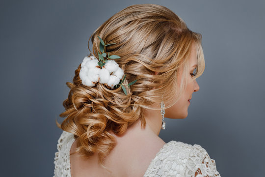 Wedding hairstyle close-up detail with cotton winter flower