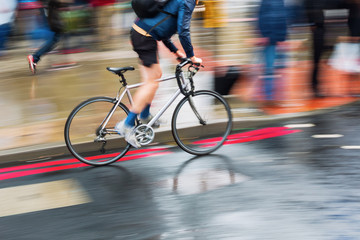 bicycle rider on a wet street