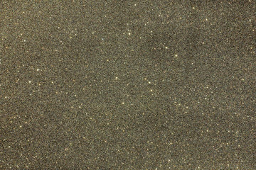  Metallic glitter background in a mixture of grey, silver, black, green and white colors.